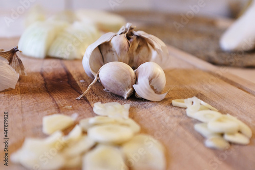 Garlics in a wooden cutting board waiting to be cooked 