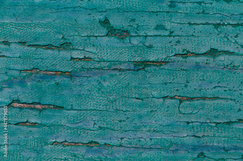 close up of painted in turquoise wooden board