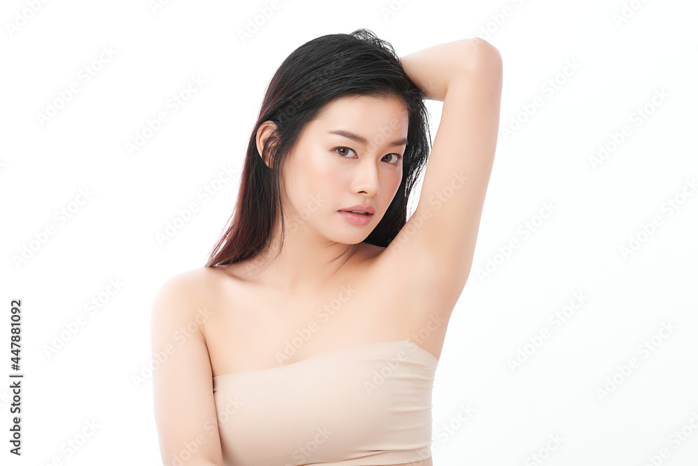 Beautiful Young Asian woman lifting hands up to show off clean and hygienic armpits or underarms on white background, Smooth armpit cleanliness and protection concept Beautiful Young Asian woman lifting hands up to show off clean and hygienic armpits or underarms on white background, Smooth armpit cleanliness and protection concept