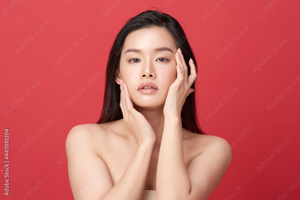 Beautiful young asian woman with clean fresh skin on red background, Face care, Facial treatment, Cosmetology, beauty and spa, Asian women portrait. Beautiful young asian woman with clean fresh skin on red background, Face care, Facial treatment, Cosmetology, beauty and spa, Asian women portrait.