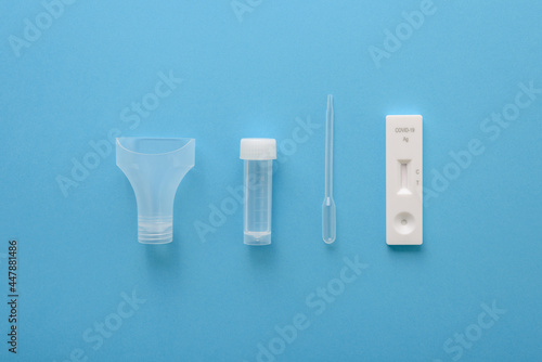 Covid19 antigen test kit with cassette, pipette and plastic bottle for saliva