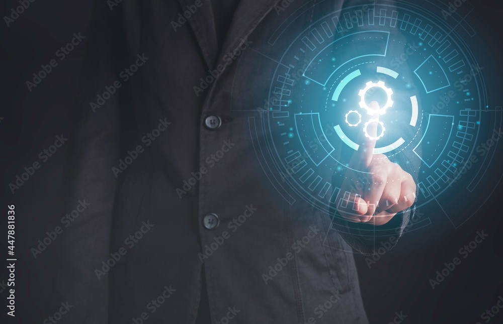Digital workflow, Digital transformation, Automatic technology concept. Businessman touching digital machine gears icons in cyber circle. Digital workflow, Digital transformation, Automatic technology concept. Businessman touching digital machine gears icons in cyber circle.