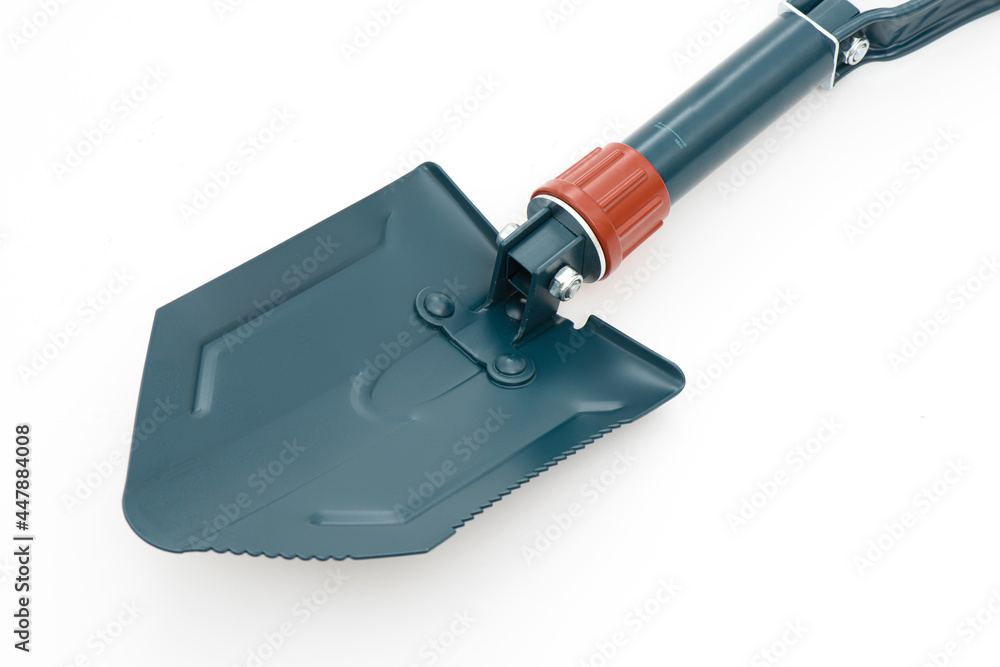 Folding camping shovel on the white background.