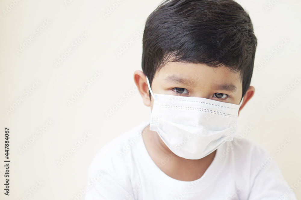 Child wearing protective medical mask to prevent Virus Corona or PM 2.5 concept. Portrait of cute little Asian 2 -3 years old toddler baby boy so sad face. Child wearing protective medical mask to prevent Virus Corona or PM 2.5 concept. Portrait of cute little Asian 2 -3 years old toddler baby boy so sad face.