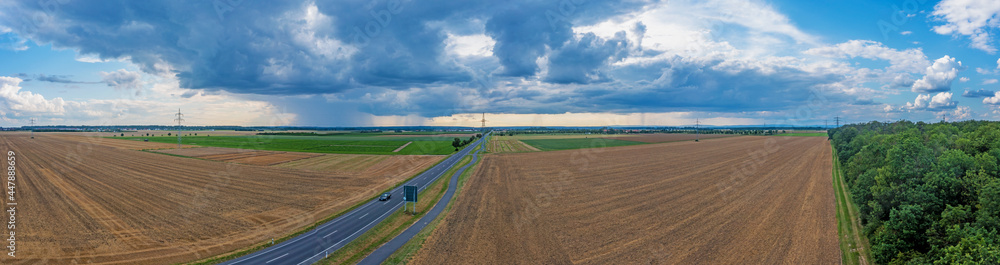 Drone panorama of a thunderstorm with rain and dramatic cloud formations over Leeheim in the Hessian Ried region