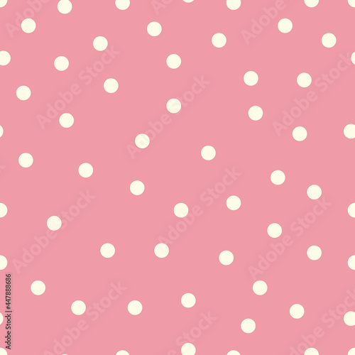 Baby pink polka dot seamless pattern background. Classic and trendy white dots on baby pink background. Perfect for fabric and wallpaper.