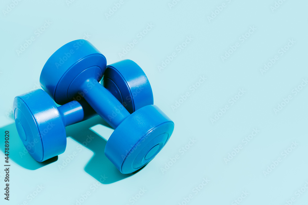 blue dumbbells on blue background. Sport and exercise. 3d illustration blue dumbbells on blue background. Sport and exercise. 3d illustration