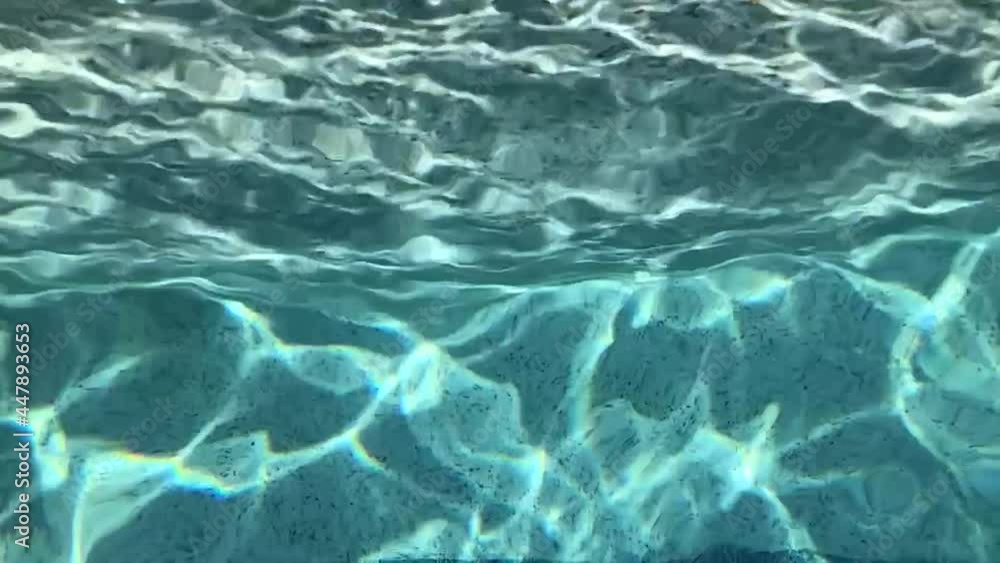 Waving blue water in a pool. Relaxation for the eyes, calm for the soul. Waving blue water in a pool. Relaxation for the eyes, calm for the soul.