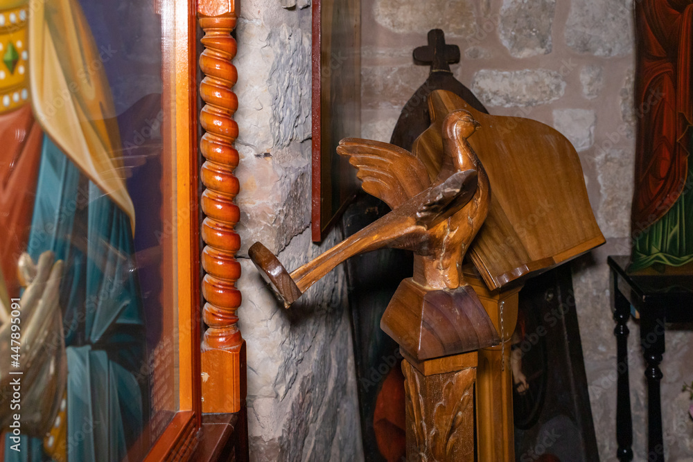 Obraz premium Carved wood decorative holders for holy books in the interior of the Sandanai Monastery in Christian quarters in the old city of Jerusalem, Israel