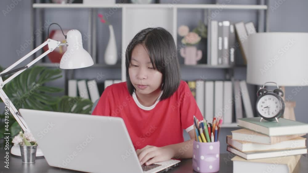 Portrait of asian girl using laptop while studying at home, remote education concept Portrait of asian girl using laptop while studying at home, remote education concept