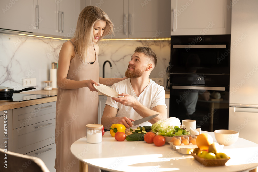 Young european couple on kitchen at home