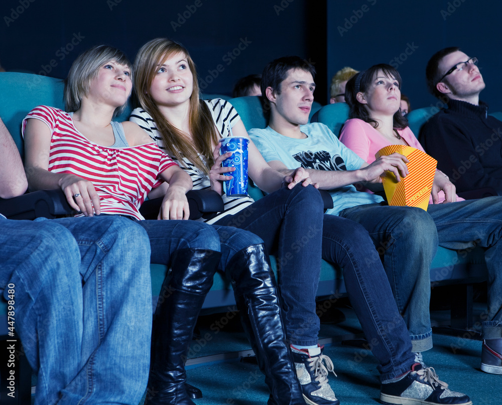 Obraz premium Smiling audience in movie theater