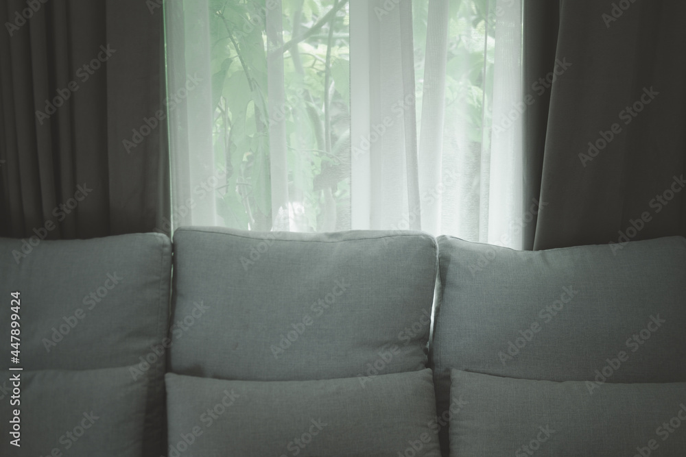 Fototapeta premium Sofa with open window curtains transparent curtain in room.