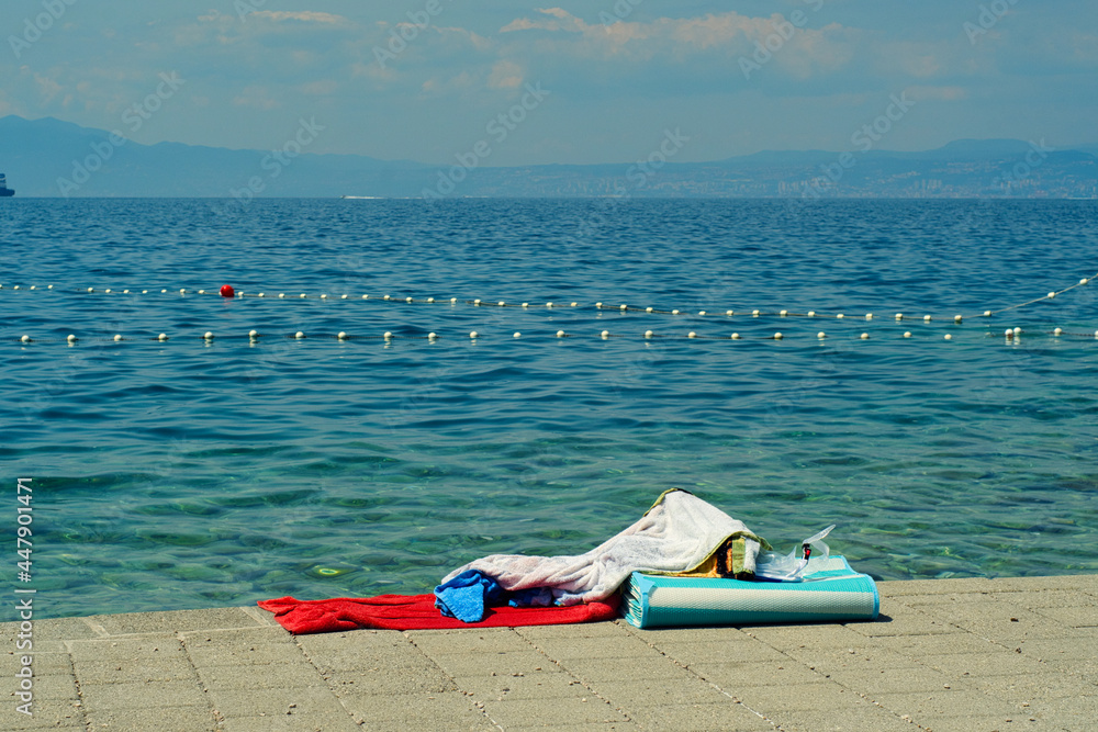 Summer holiday vibes - swimming towel on the remote beach of Croatia island Krk on Adriatic sea