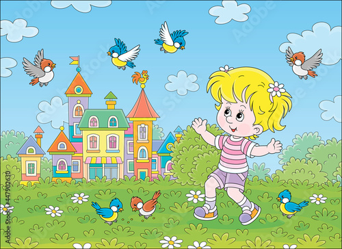 Happy little girl playing with a flock of merry sparrows and titmice in a green summer park of a pretty small town with colorful houses, vector cartoon illustration