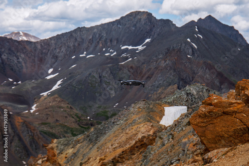 Unmanned aerial vehicle with a radio-controlled camera or UAV. Unmanned aerial vehicle in the mountains of the Altai Republic.