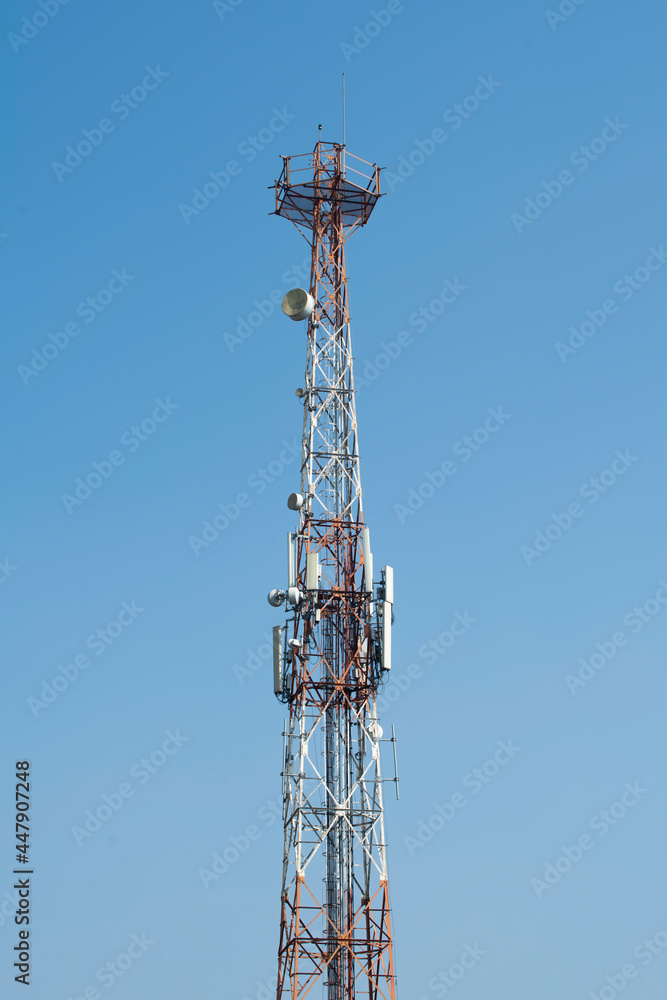 Communications tower with blue Cloud sky background Communications tower with blue Cloud sky background
