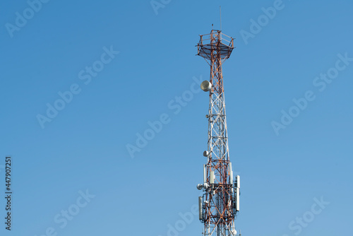 Communications tower with blue Cloud sky background