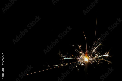 sparkler on black background with copy space
