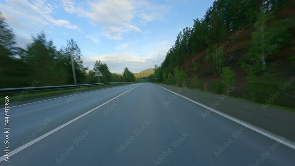 Drive to the high mountains. The concept of independent travel and tourism. Asphalted road among dense coniferous forests. High quality. 4k footage. Drive to the high mountains. The concept of independent travel and tourism. Asphalted road among dense coniferous forests. High quality. 4k footage.
