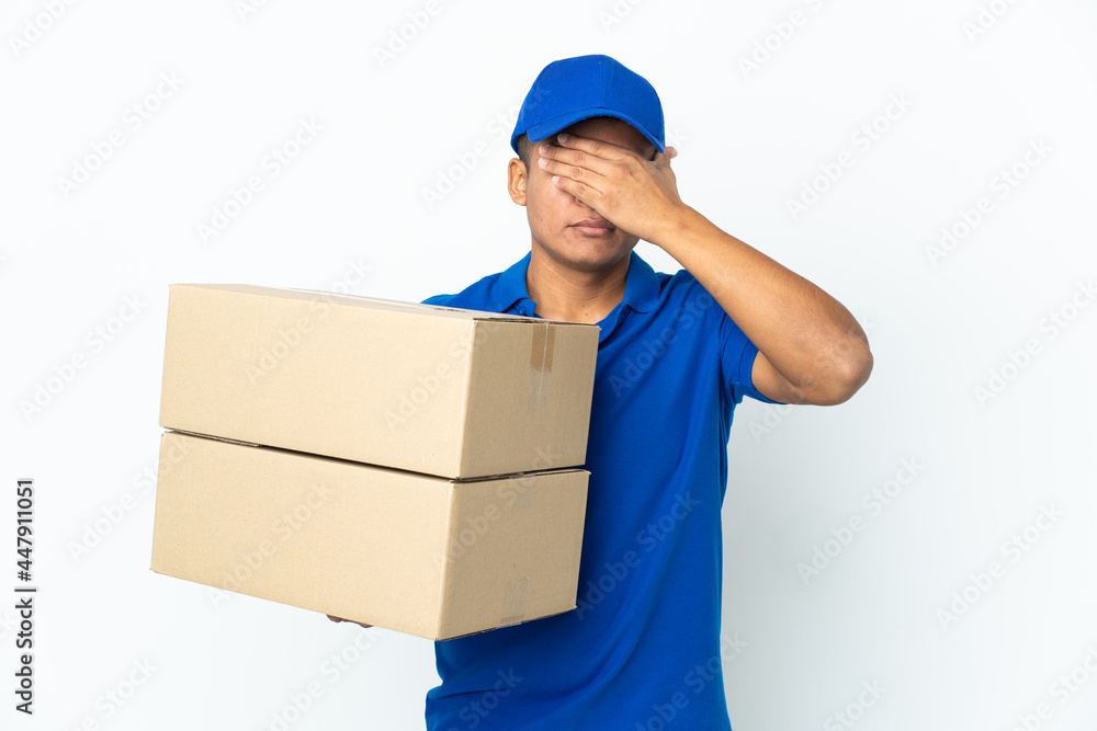Delivery Ecuadorian man isolated on white background covering eyes by hands. Do not want to see something Delivery Ecuadorian man isolated on white background covering eyes by hands. Do not want to see something