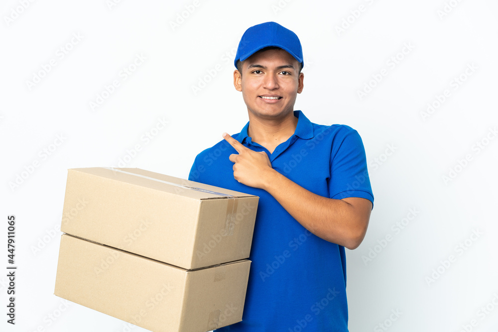 Delivery Ecuadorian man isolated on white background pointing to the side to present a product Delivery Ecuadorian man isolated on white background pointing to the side to present a product