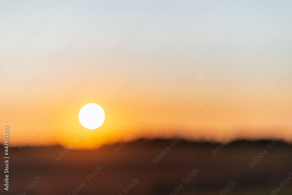 Blurred sunset landscape.Summer holiday concept. blurry beautiful sunlight and golden sunset background. Blurred sunset landscape.Summer holiday concept. blurry beautiful sunlight and golden sunset background.