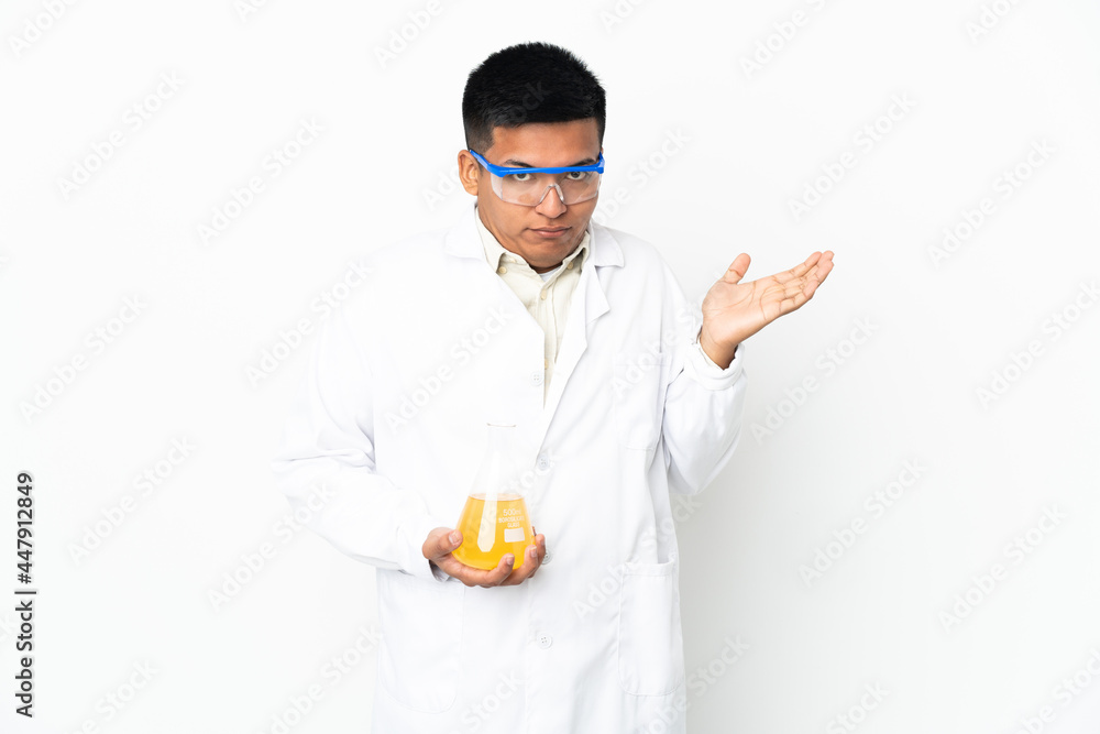 Young Ecuadorian scientific man having doubts while raising hands Young Ecuadorian scientific man having doubts while raising hands