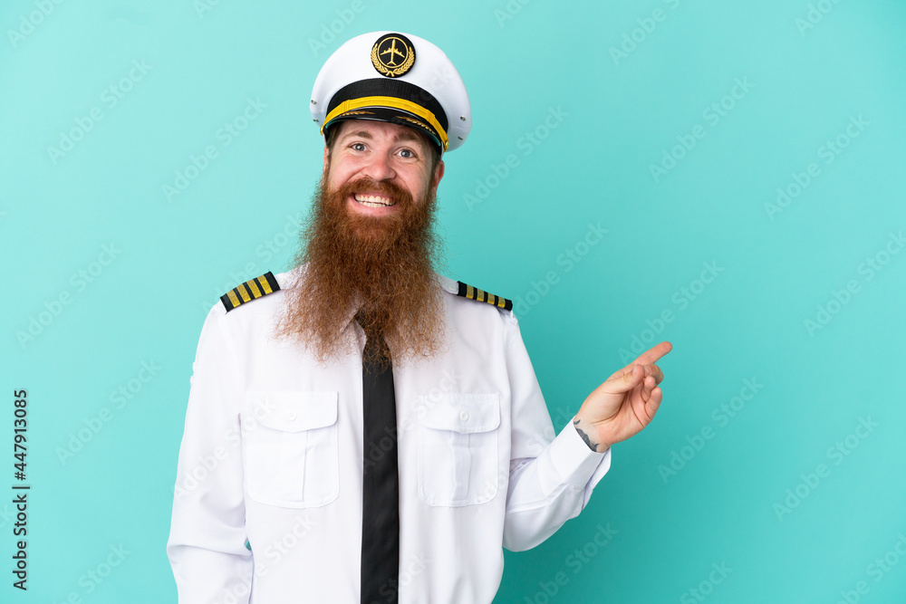 Redhead caucasian man playing rugby isolated on yellow background pointing finger to the side Redhead caucasian man playing rugby isolated on yellow background pointing finger to the side