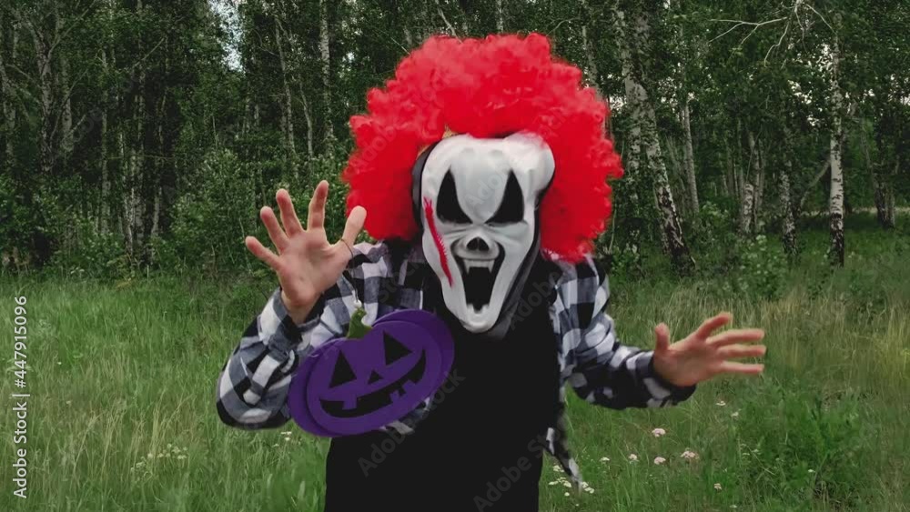 Scary clown dances and scares at a Halloween party. Scary clown dances and scares at a Halloween party.