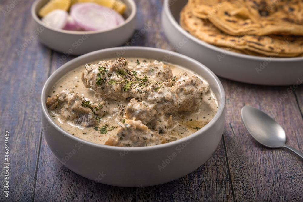cream chicken curry with flatbread chapati or parantha cream chicken curry with flatbread chapati or parantha