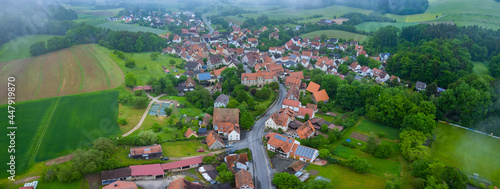 Aerial view of the city Neunhof bei Lauf an der Pegnitz in Germany, Bavaria on a cloudy day in spring