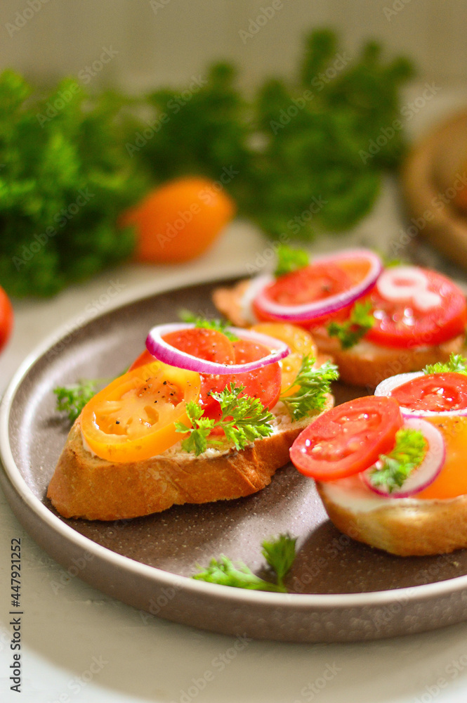 Tasty bruschetta with tomato. Easy cook, nutritious snack. Beautifully decorated catering banquet menu. Food snacks and appetizers for buffet Tasty bruschetta with tomato. Easy cook, nutritious snack. Beautifully decorated catering banquet menu. Food snacks and appetizers for buffet