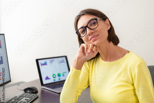 Caucasian advisor financial business analytics woman with data dashboard graphs smiles happy mood