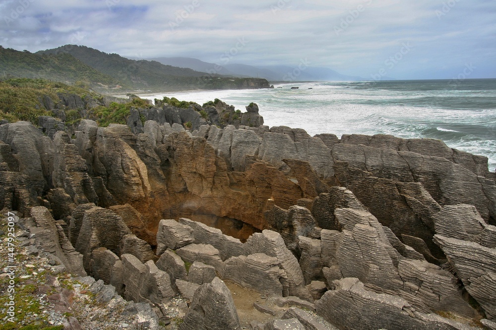 View of Pancake Rocks and Blowholes and Tasman Sea, Paparoa National Park. South Island. New Zealand.