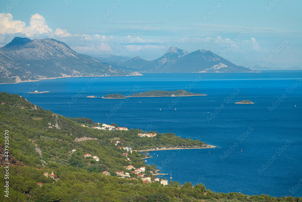 AERIAL: Kitesurfers catching wind between Croatian mainland and remote island.