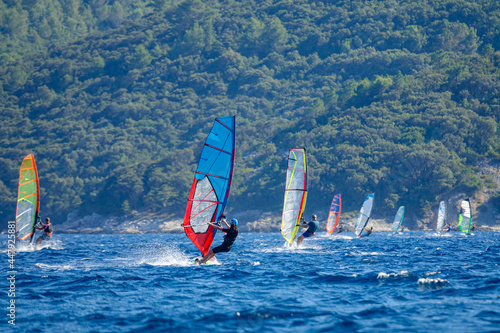 Countless kitesurfers flock to surf near Peljesac, Croatia at peak of summer.
