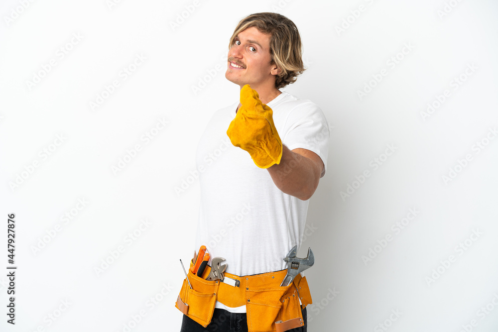 Young electrician blonde man isolated on white background making money gesture Young electrician blonde man isolated on white background making money gesture