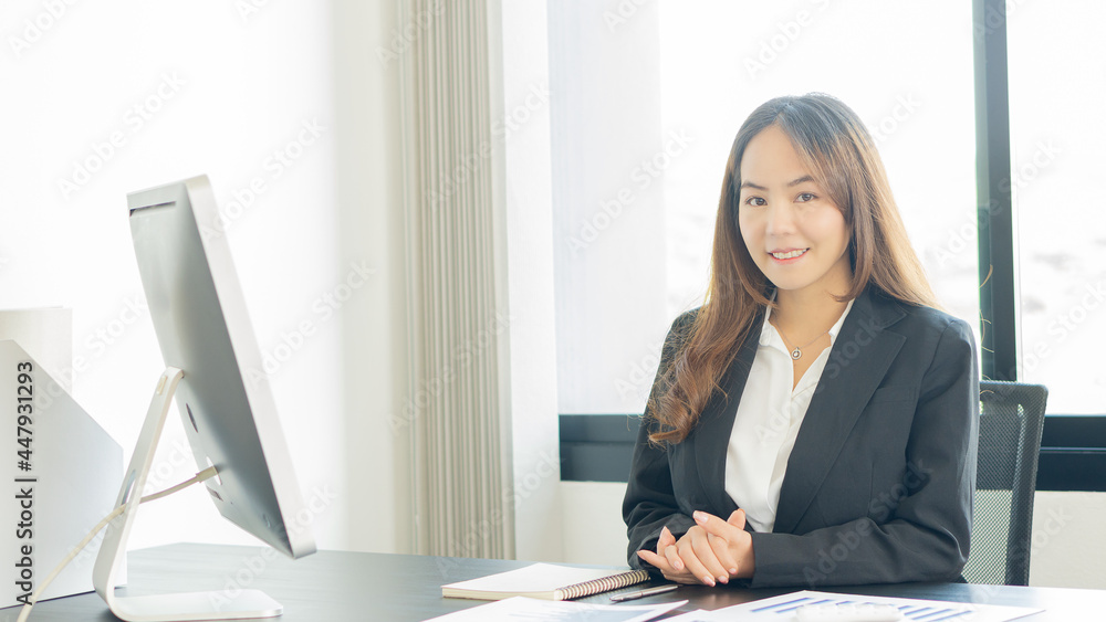 Young Asian businesswoman working on laptop and analyzing financial accounting graphs in home office Young Asian businesswoman working on laptop and analyzing financial accounting graphs in home office