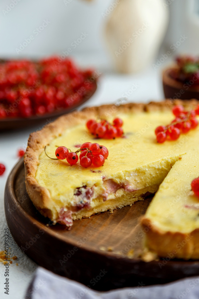 homemade tart with red currants and gooseberries. on a white background, the atmosphere of morning and comfort
homemade tart with red currants and gooseberries. on a white background, the atmosphere of morning and comfort