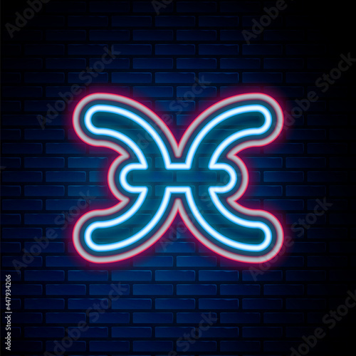 Glowing neon line Pisces zodiac sign icon isolated on brick wall background. Astrological horoscope collection. Colorful outline concept. Vector