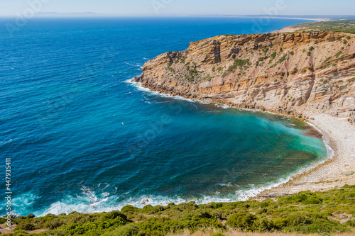 Cliff view of Lagosteiros beach with the Sintra mountains on the horizon, Sesimbra PORTUGAL