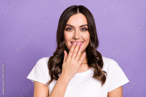 Photo of funny brunette millennial lady laugh wear white t-shirt isolated on violet color background