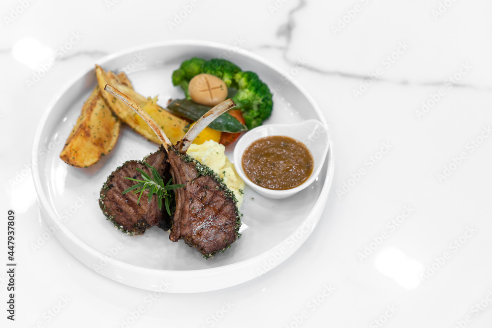 Lamb Steak and mashed potatoes on white dish Lamb Steak and mashed potatoes on white dish