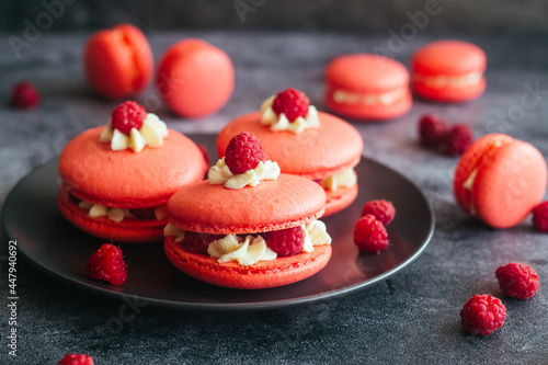 Macaroons. Delicious french desserts. Macaroons with raspberries and cream cheese. Macaroons on the table