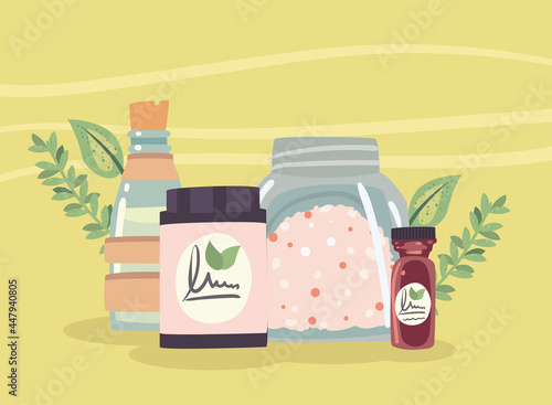 Spa center bottle and jars with leaves