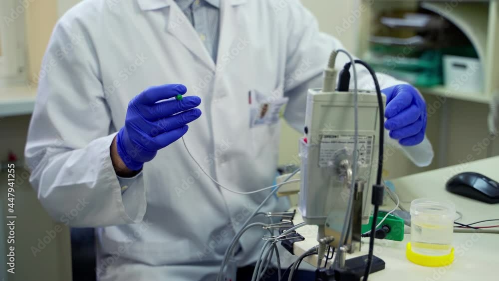 Doctor preparing medical equipment. Close up of doctor hands using medical equipment Doctor preparing medical equipment. Close up of doctor hands using medical equipment