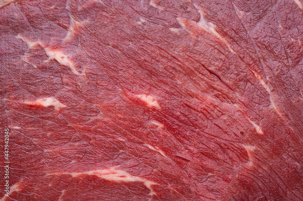 Texture of a red meat background close up. Texture of a red meat background close up.