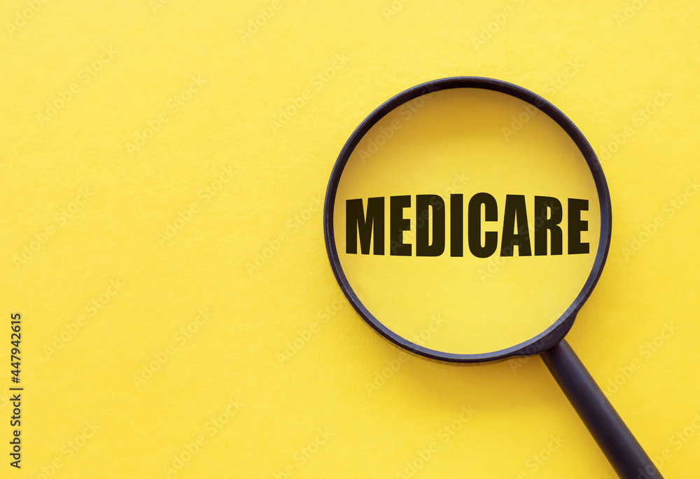 Magnifier with word medicare over yellow background Magnifier with word medicare over yellow background