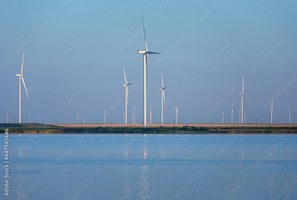 Background of the wind mills farm on the shore